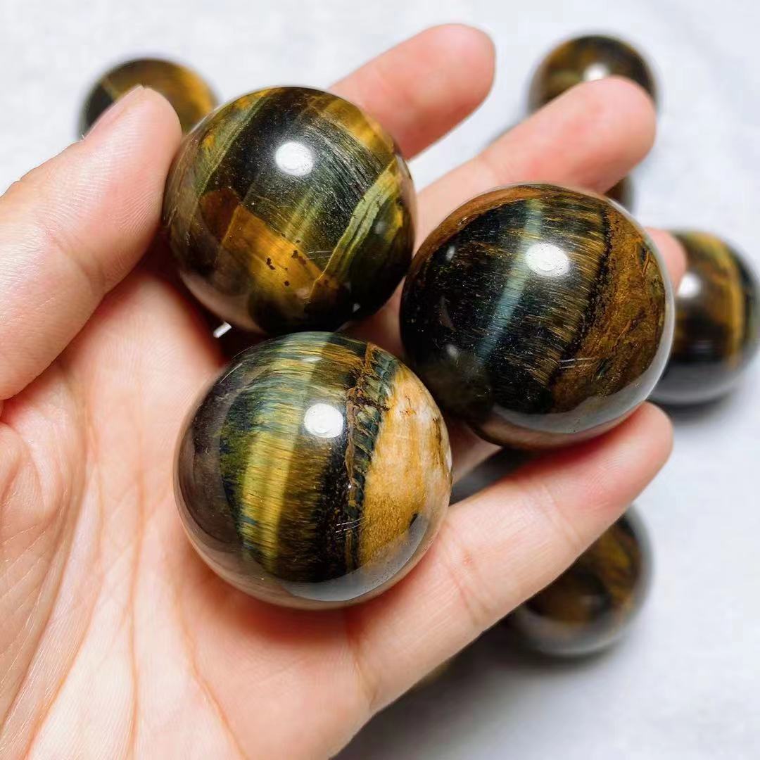 Yellow and blue tiger eye spheres crystal sphere