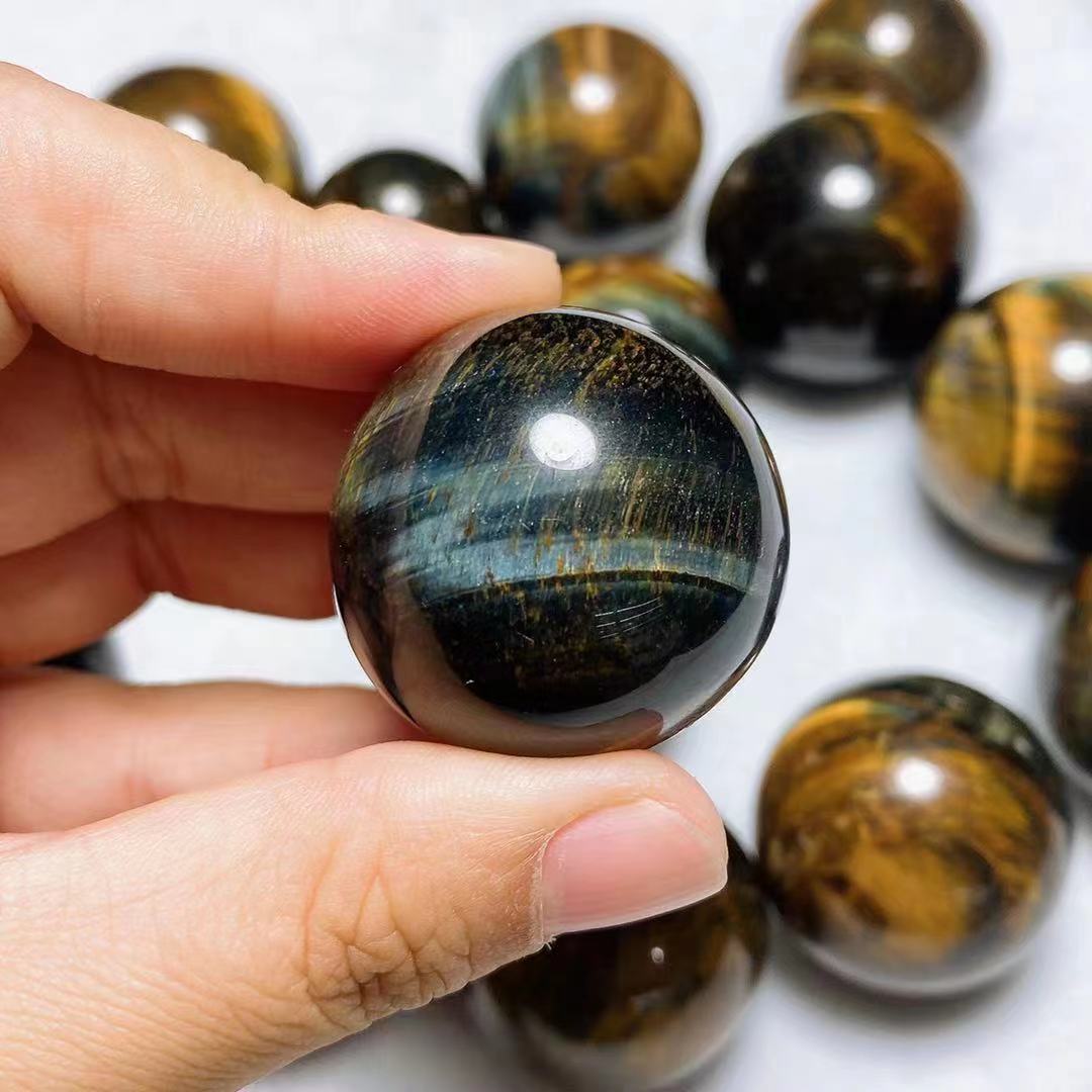 Yellow and blue tiger eye spheres crystal sphere