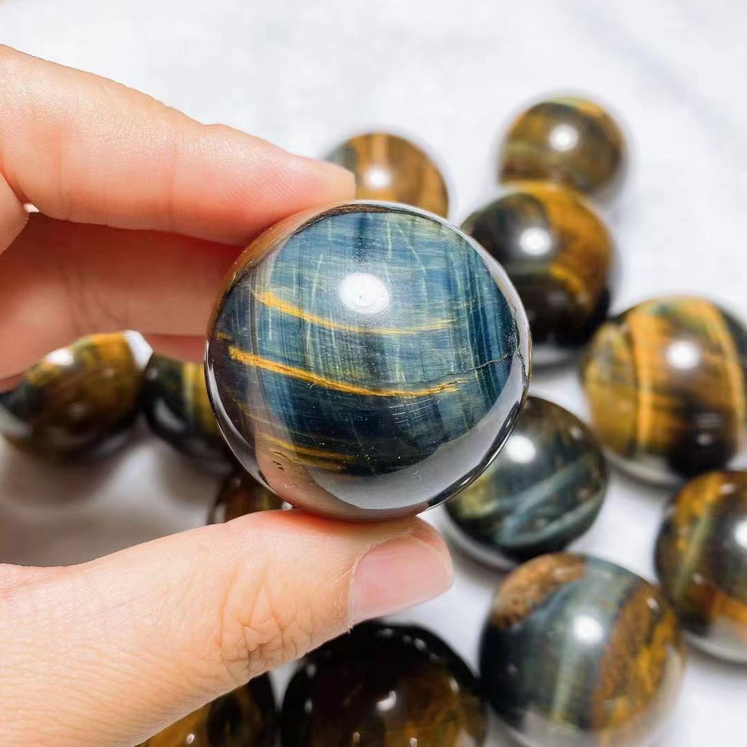 Yellow and blue tiger eye spheres crystal sphere